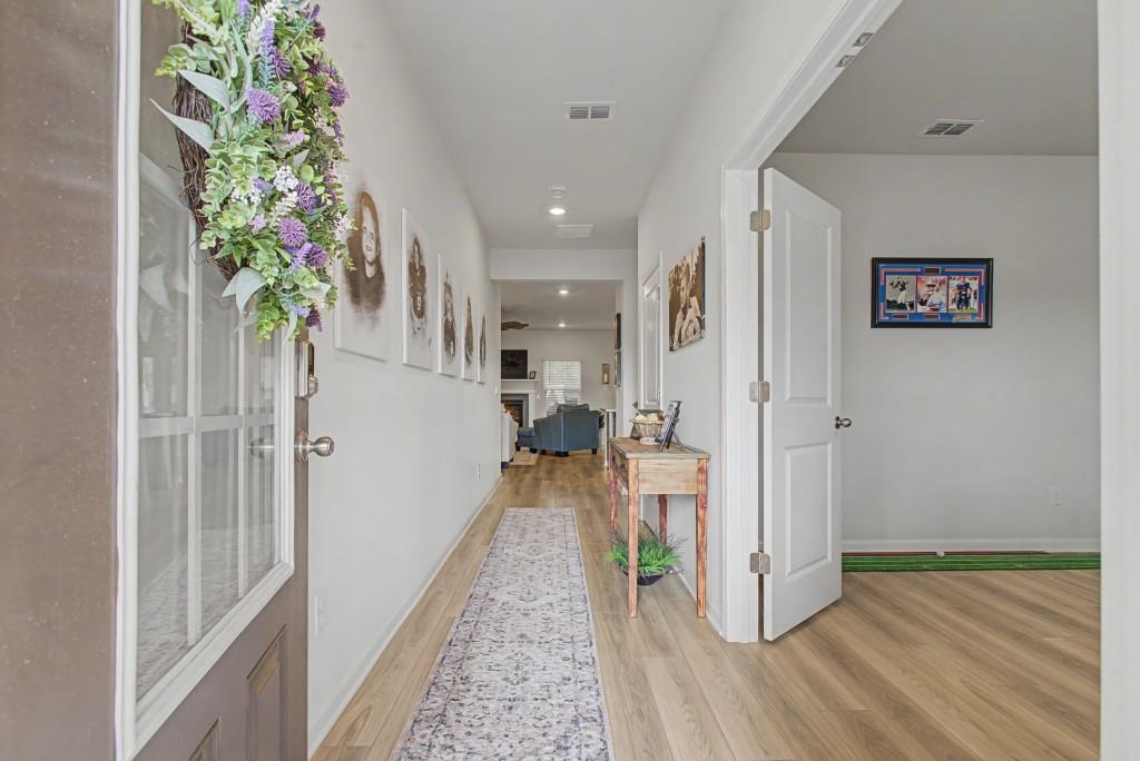 87 Cranson Walk Pendergrass, GA 30567 - Photo 6 of 50 a view of a hallway with wooden floor and staircase