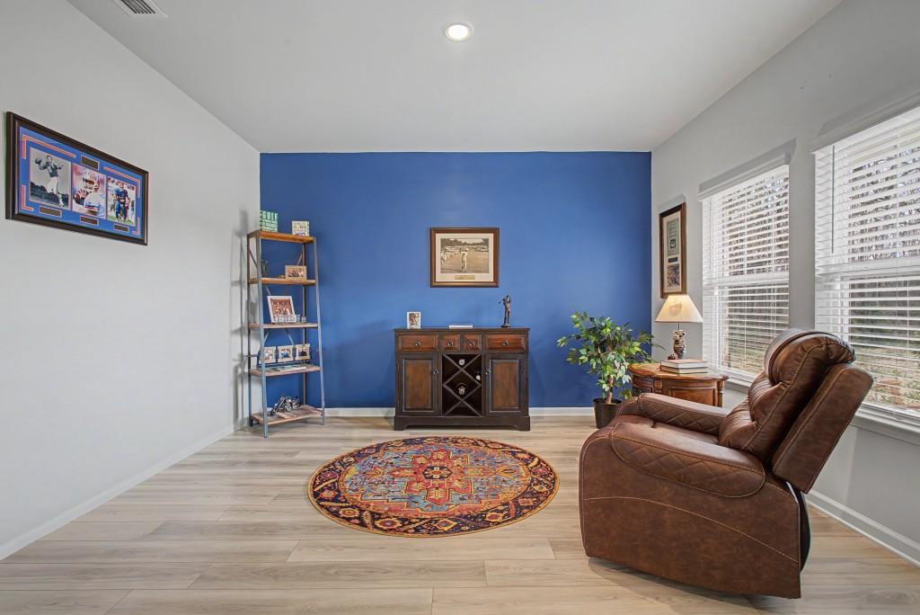 87 Cranson Walk Pendergrass, GA 30567 - Photo 9 of 50 a living room with furniture or couch and a large window