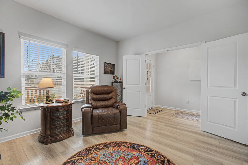 87 Cranson Walk Pendergrass, GA 30567 - Photo 10 of 50 a living room with furniture and a wooden floor