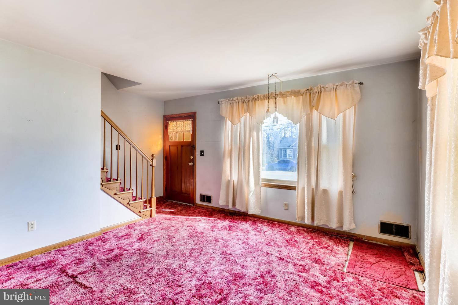 7510 Harmans Road Harmans, MD 21077 - Photo 3 of 11 wooden floor in an empty room with a window