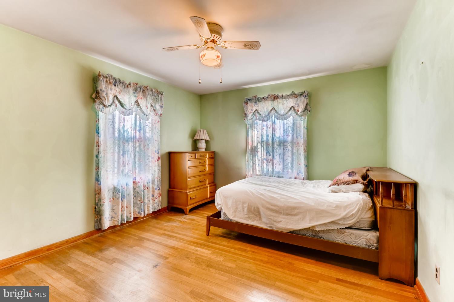 7510 Harmans Road Harmans, MD 21077 - Photo 4 of 11 a bedroom with a bed and window