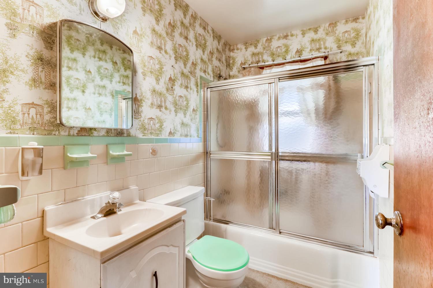 7510 Harmans Road Harmans, MD 21077 - Photo 5 of 11 a bathroom with a sink toilet and shower
