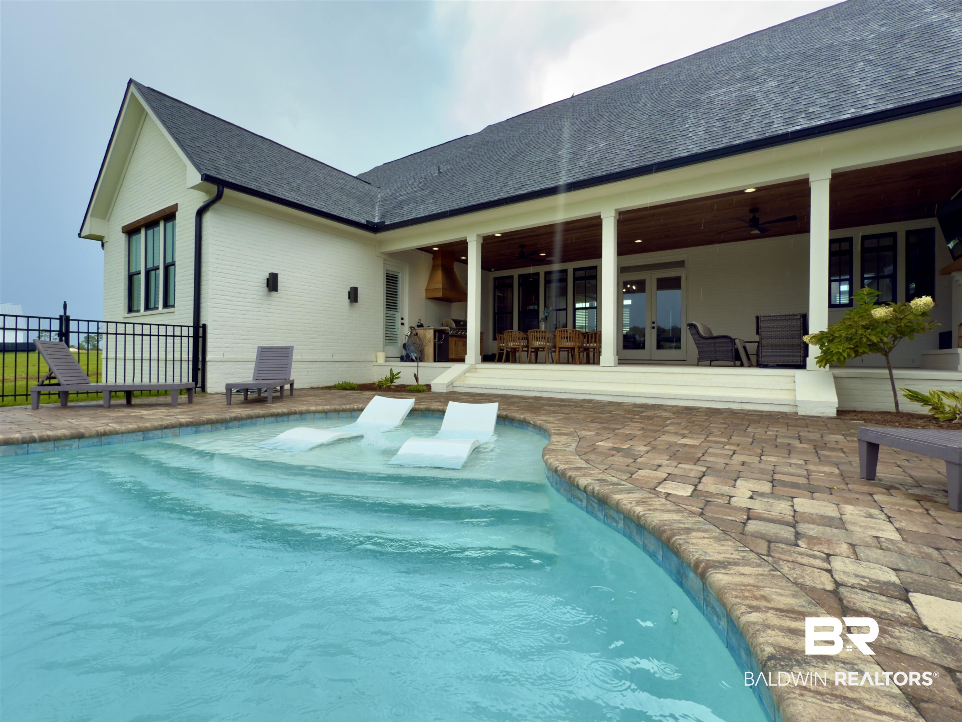 21767 Gallery Boulevard Fairhope, AL 36532 - Photo 68 of 74 Outdoor pool with french doors, ceiling fan, and a patio area