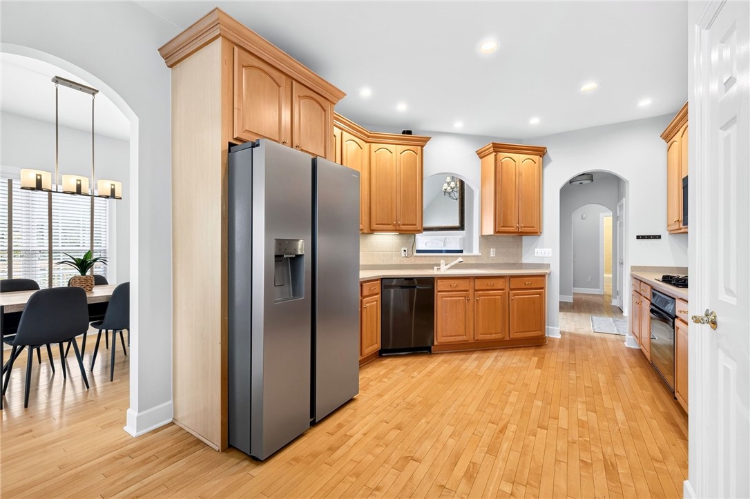 47 New London Road Henrietta, NY 14534 - Photo 10 of 44 Open kitchen with hard wood floors and new refrige