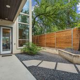 a view of house with backyard and garden
