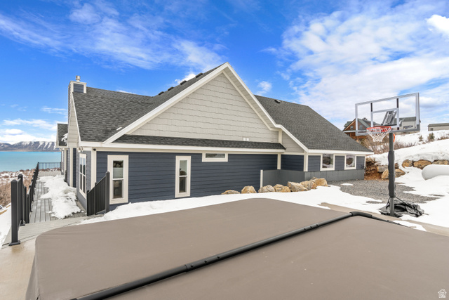 1343 North Trapper Loop Garden City, UT 84028 - Photo 42 of 56 View of front of property with roof with shingles and a chimney