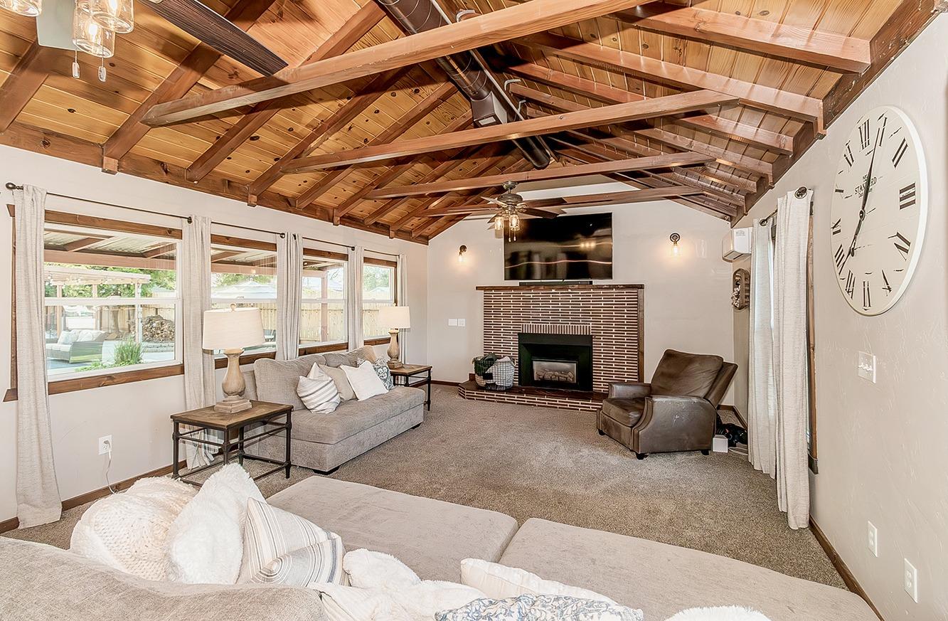 1053 K Street Reedley, CA 93654 - Photo 20 of 62 a living room with furniture and a fireplace