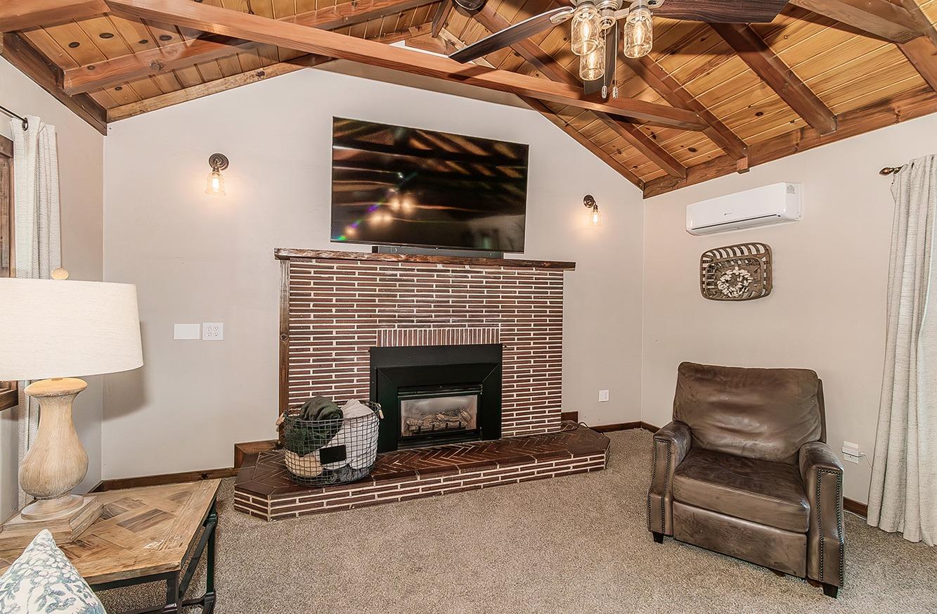 1053 K Street Reedley, CA 93654 - Photo 21 of 62 a living room with furniture and a fireplace