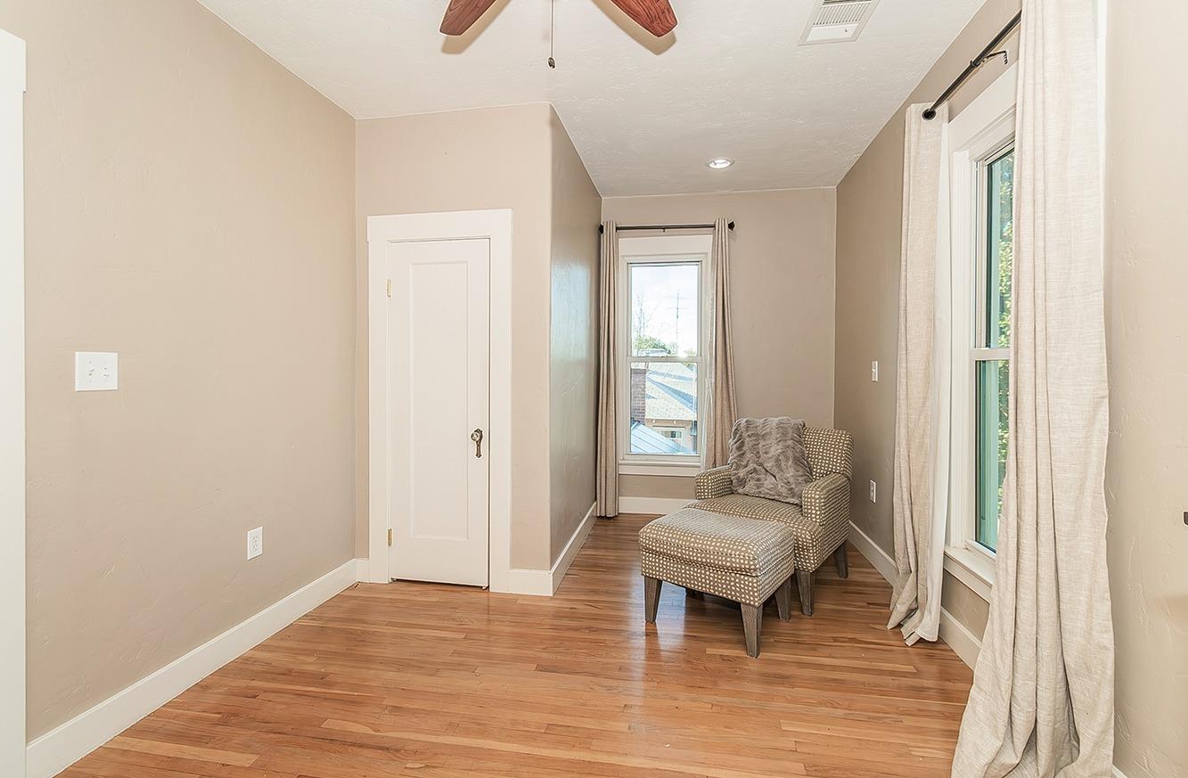 1053 K Street Reedley, CA 93654 - Photo 32 of 62 a living room with a couch and a window