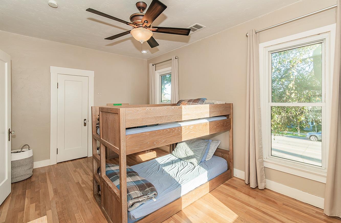 1053 K Street Reedley, CA 93654 - Photo 33 of 62 a bed room with a bed and a window