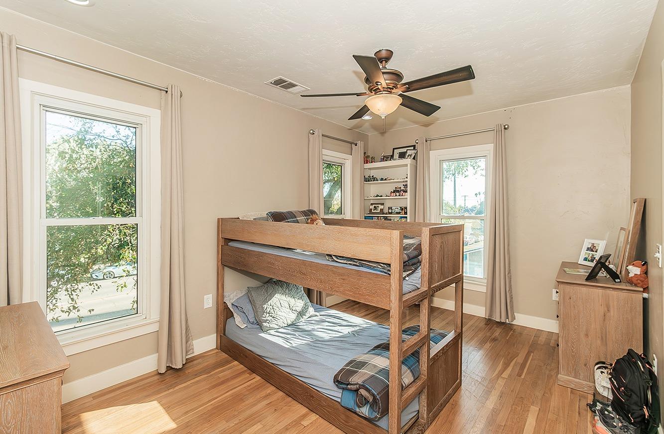 1053 K Street Reedley, CA 93654 - Photo 34 of 62 a room with chandelier fan and windows