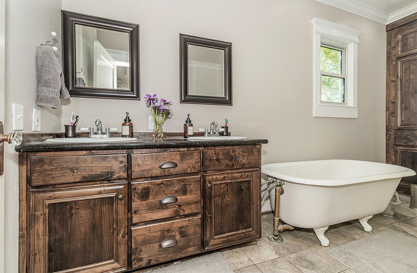 1053 K Street Reedley, CA 93654 - Photo 36 of 62 a bathroom with a toilet sink and mirror