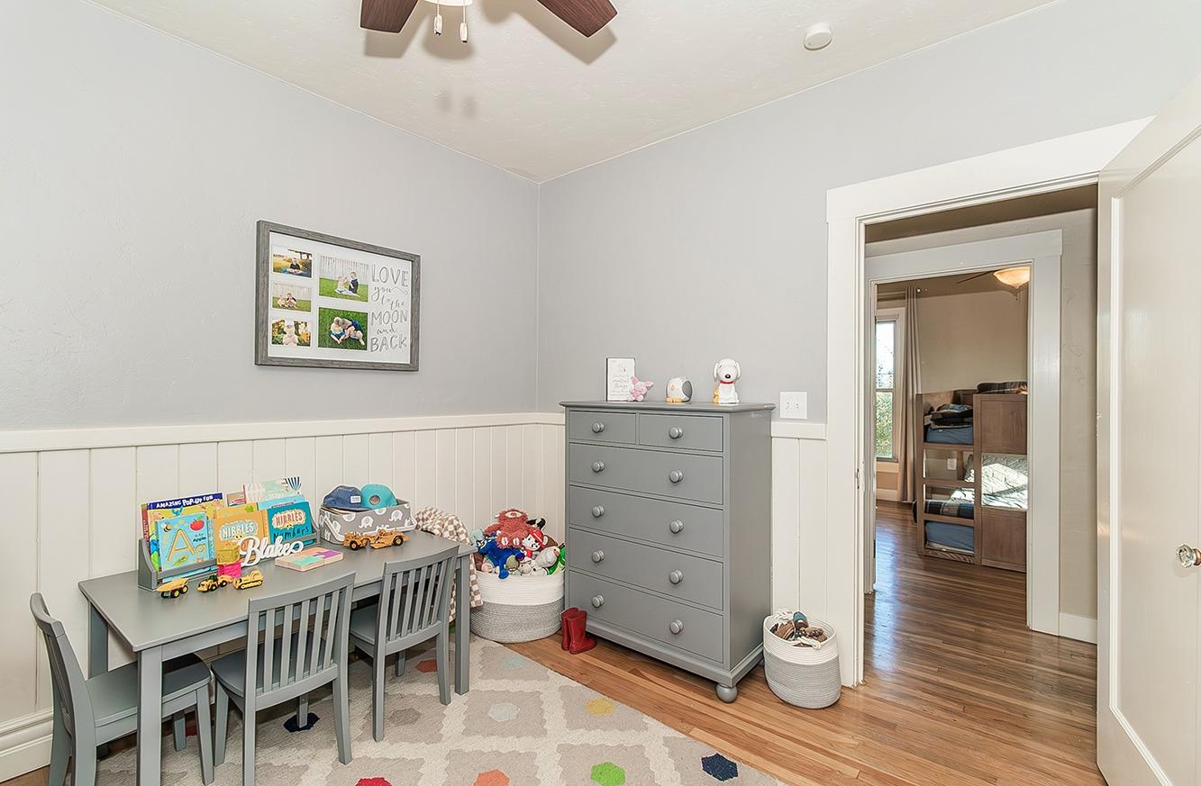1053 K Street Reedley, CA 93654 - Photo 39 of 62 a dining room with wooden furniture and wooden floor