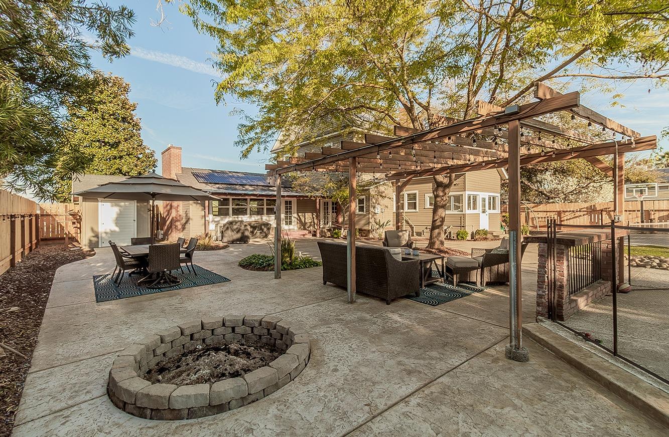 1053 K Street Reedley, CA 93654 - Photo 45 of 62 a view of a patio with table and chairs and a fire pit