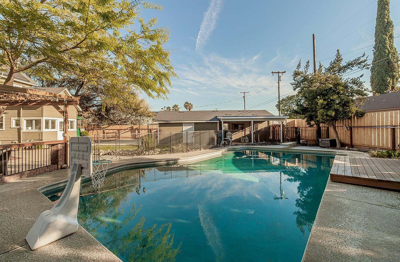 1053 K Street Reedley, CA 93654 - Photo 47 of 62 a view of a swimming pool with a patio