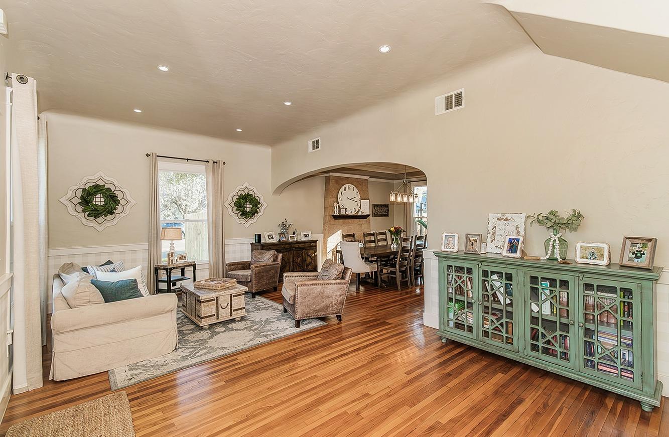 1053 K Street Reedley, CA 93654 - Photo 5 of 62 a living room with furniture and a wooden floor