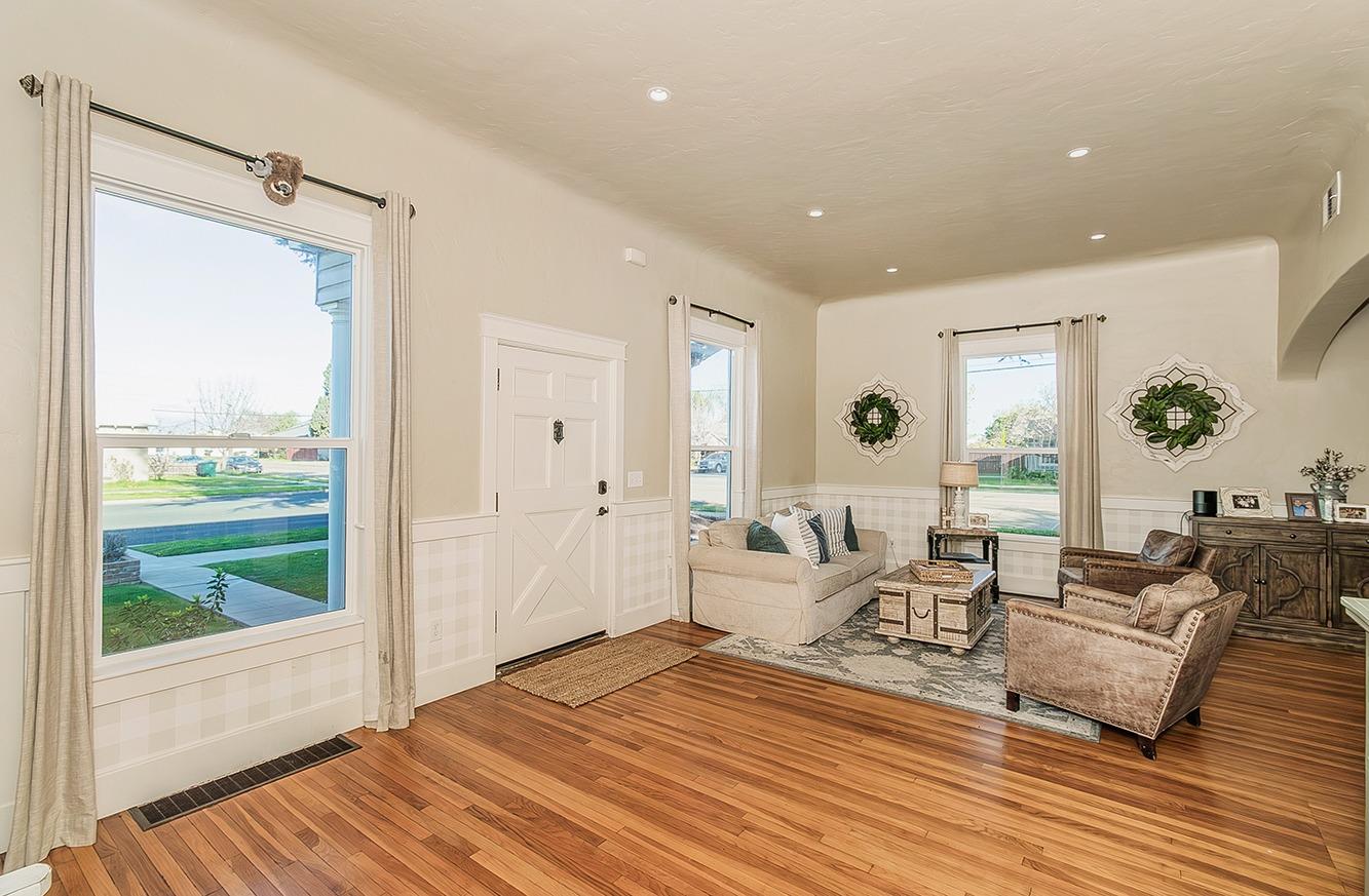 1053 K Street Reedley, CA 93654 - Photo 6 of 62 a living room with furniture and a large window