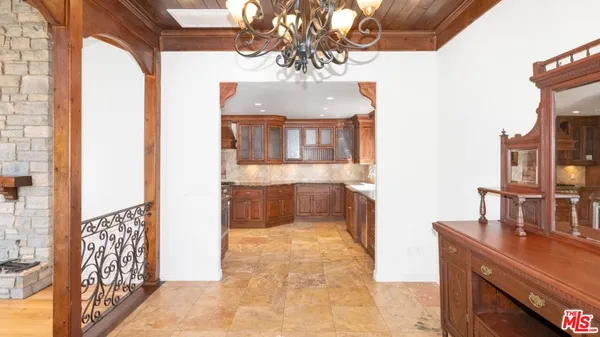 a kitchen with stainless steel appliances granite countertop a refrigerator and a stove