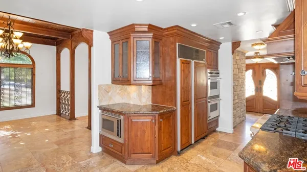 a bathroom with a sink and a large mirror