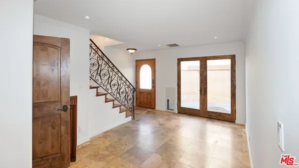 a view of a livingroom with an empty space and a fireplace