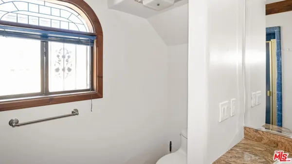 a bathroom with a tub and shower