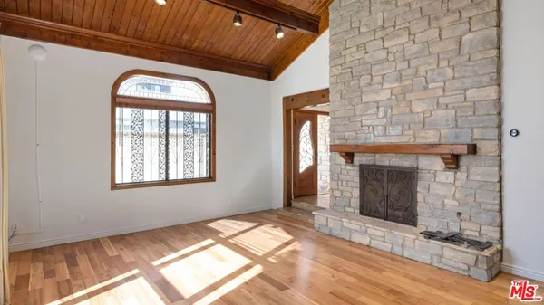 a kitchen with stainless steel appliances granite countertop a stove and a refrigerator