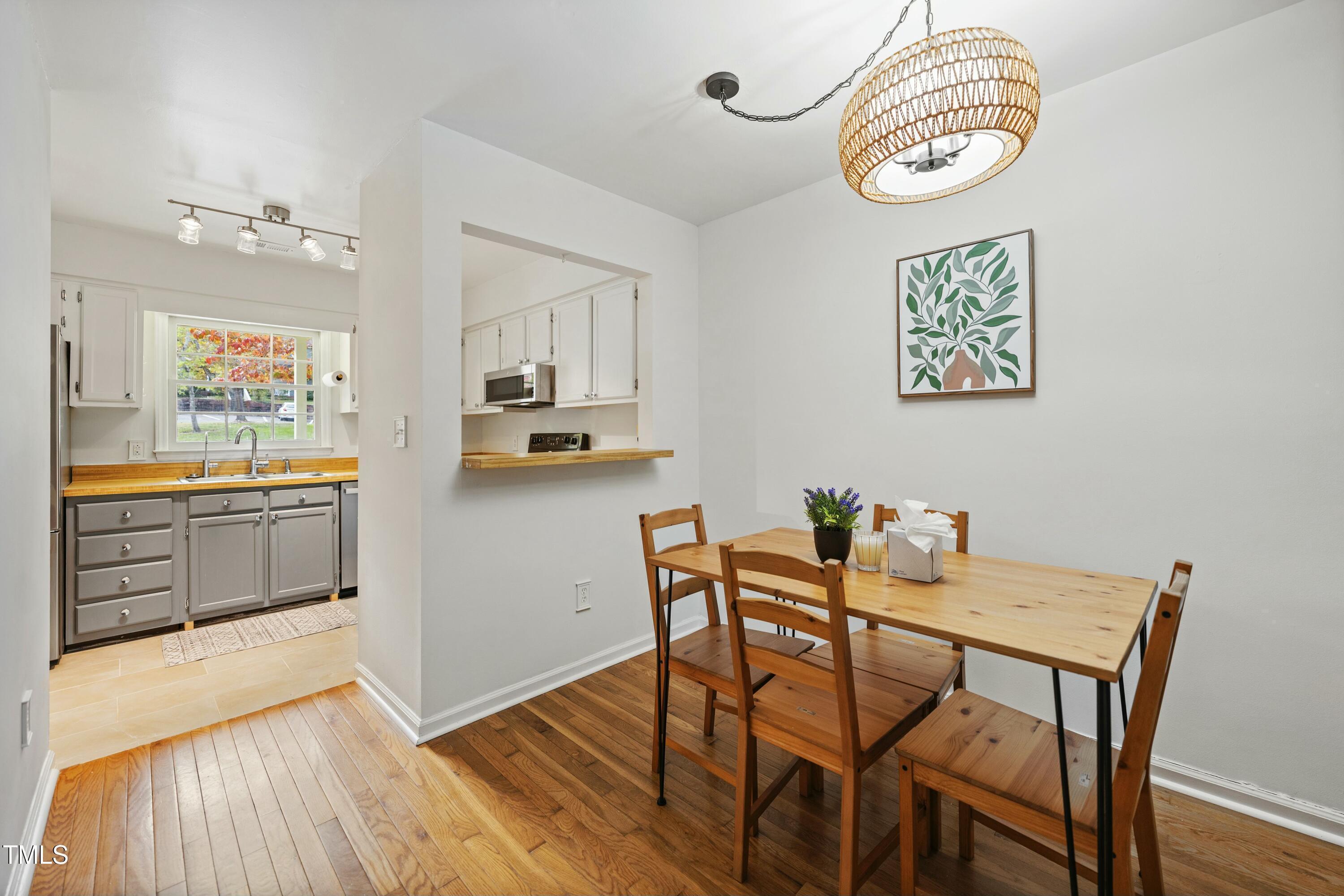 126 Shady Spring Place Durham, NC 27713 - Photo 4 of 14 a view of a dining room with furniture and a kitchen view