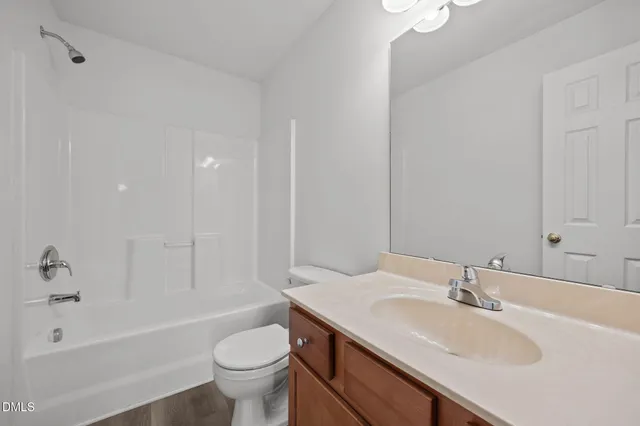 a bathroom with a sink a toilet and a bathtub