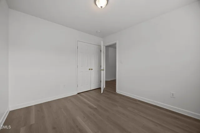 a view of backyard with a deck and wooden floor