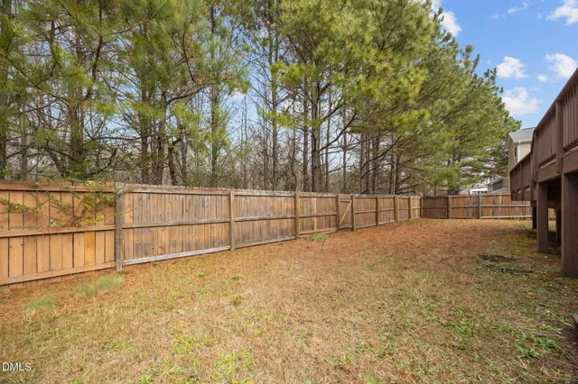 an aerial view of a house with outdoor space