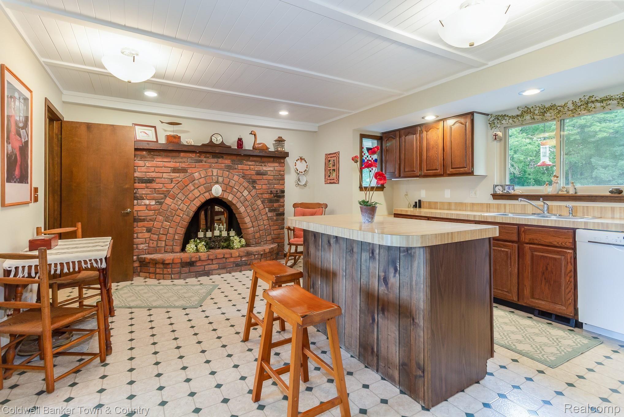 7684 Pinckney Road Pinckney, MI 48169 - Photo 13 of 23 Country Kitchen with Natural Fireplace