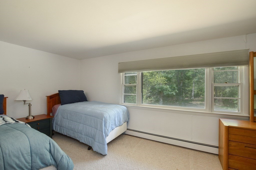 230 Pimlico Pond Road Mashpee, MA 02649 - Photo 21 of 35 a bedroom with a bed and a large window