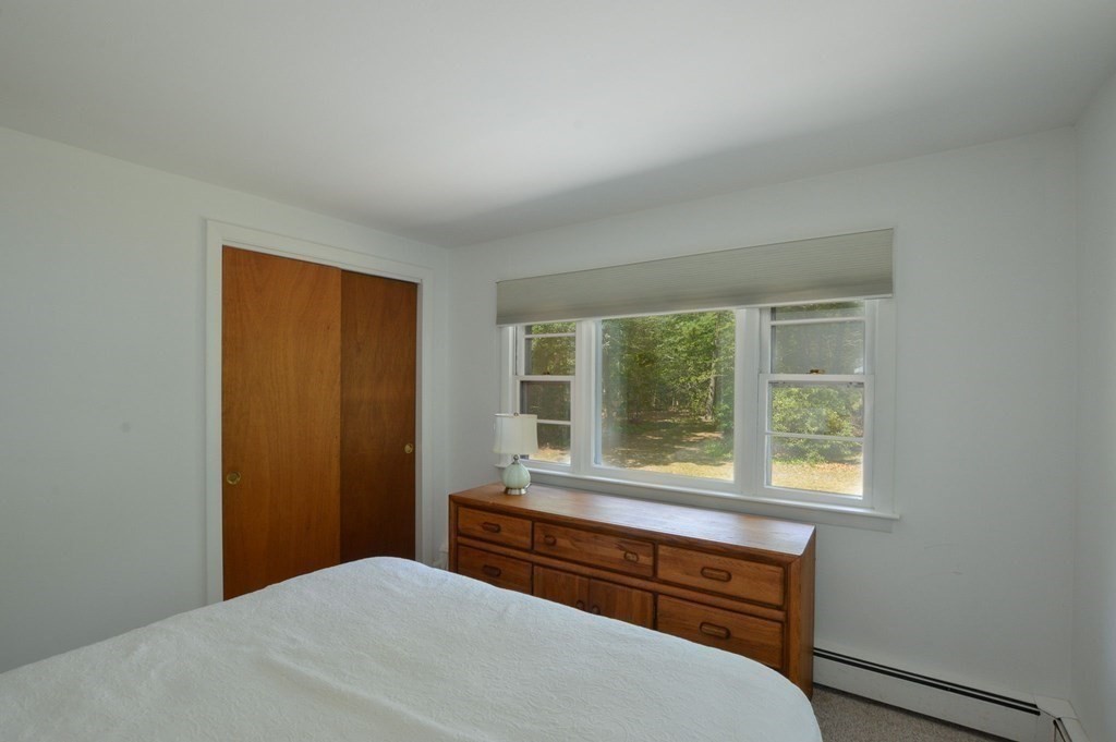230 Pimlico Pond Road Mashpee, MA 02649 - Photo 28 of 35 a bedroom with a bed and a window