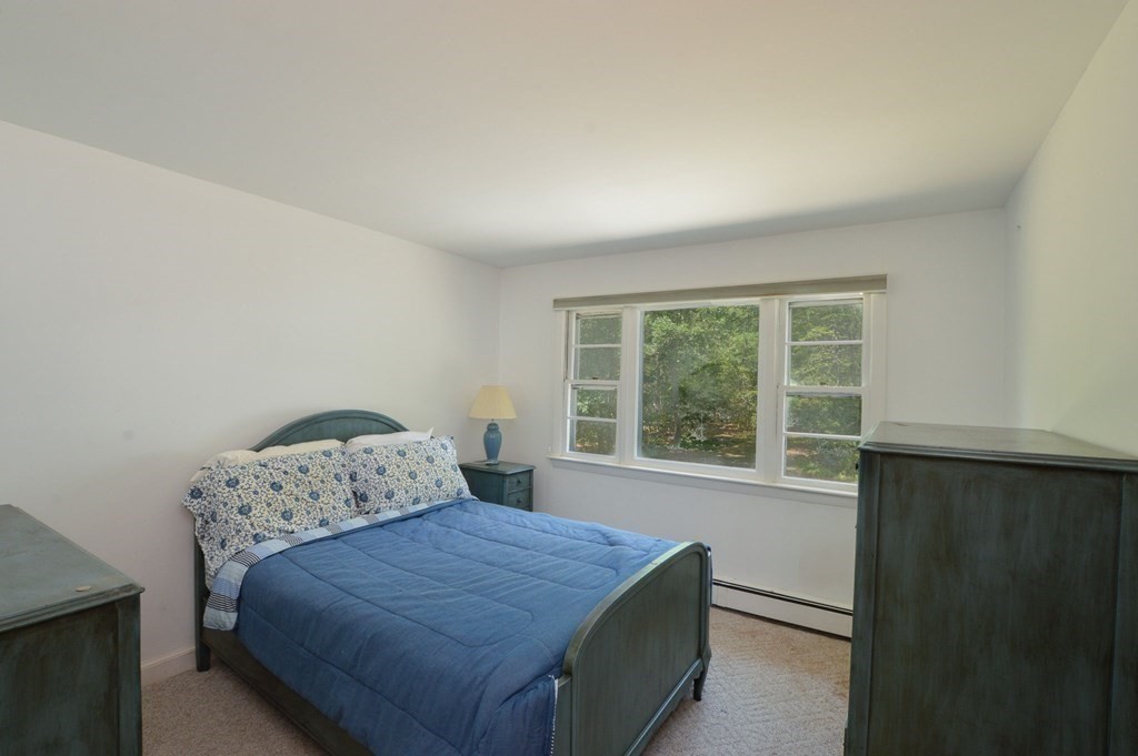 230 Pimlico Pond Road Mashpee, MA 02649 - Photo 29 of 35 a bedroom with a bed and a window