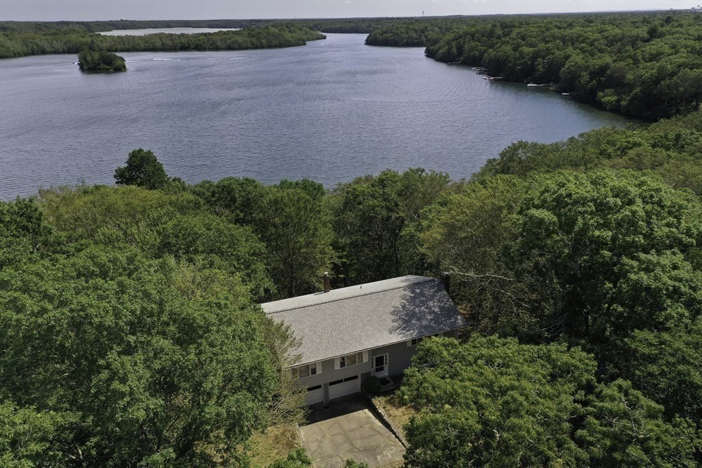 230 Pimlico Pond Road Mashpee, MA 02649 - Photo 7 of 35 an aerial view of a house with a yard and lake view