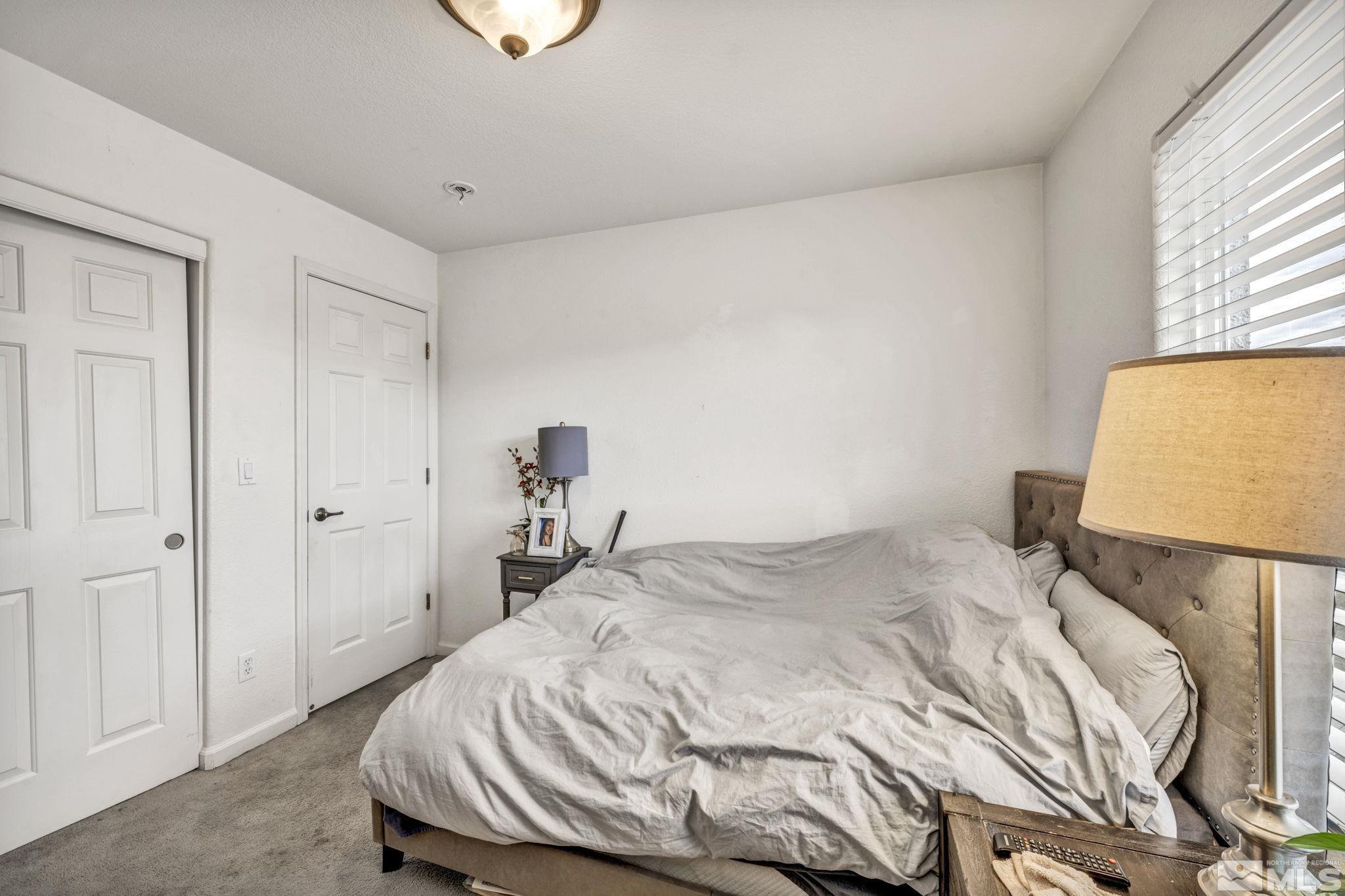 1770 Ornellaia Way Reno, NV 89521 - Photo 12 of 37 a bedroom with a bed and a window