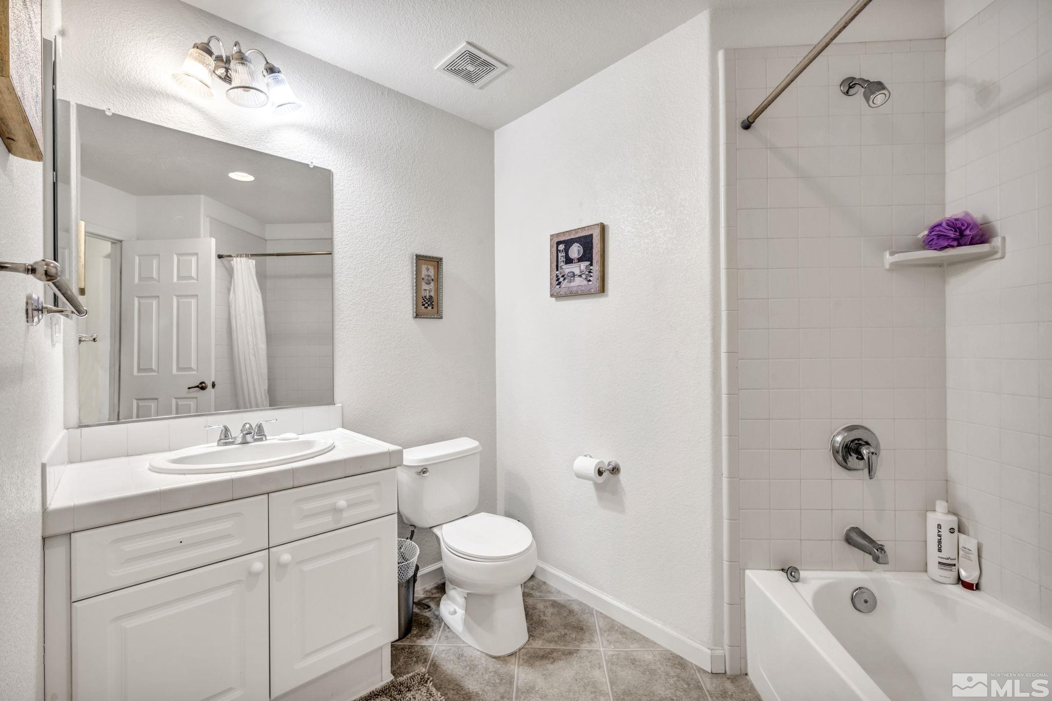 1770 Ornellaia Way Reno, NV 89521 - Photo 13 of 37 a bathroom with a sink a toilet and shower