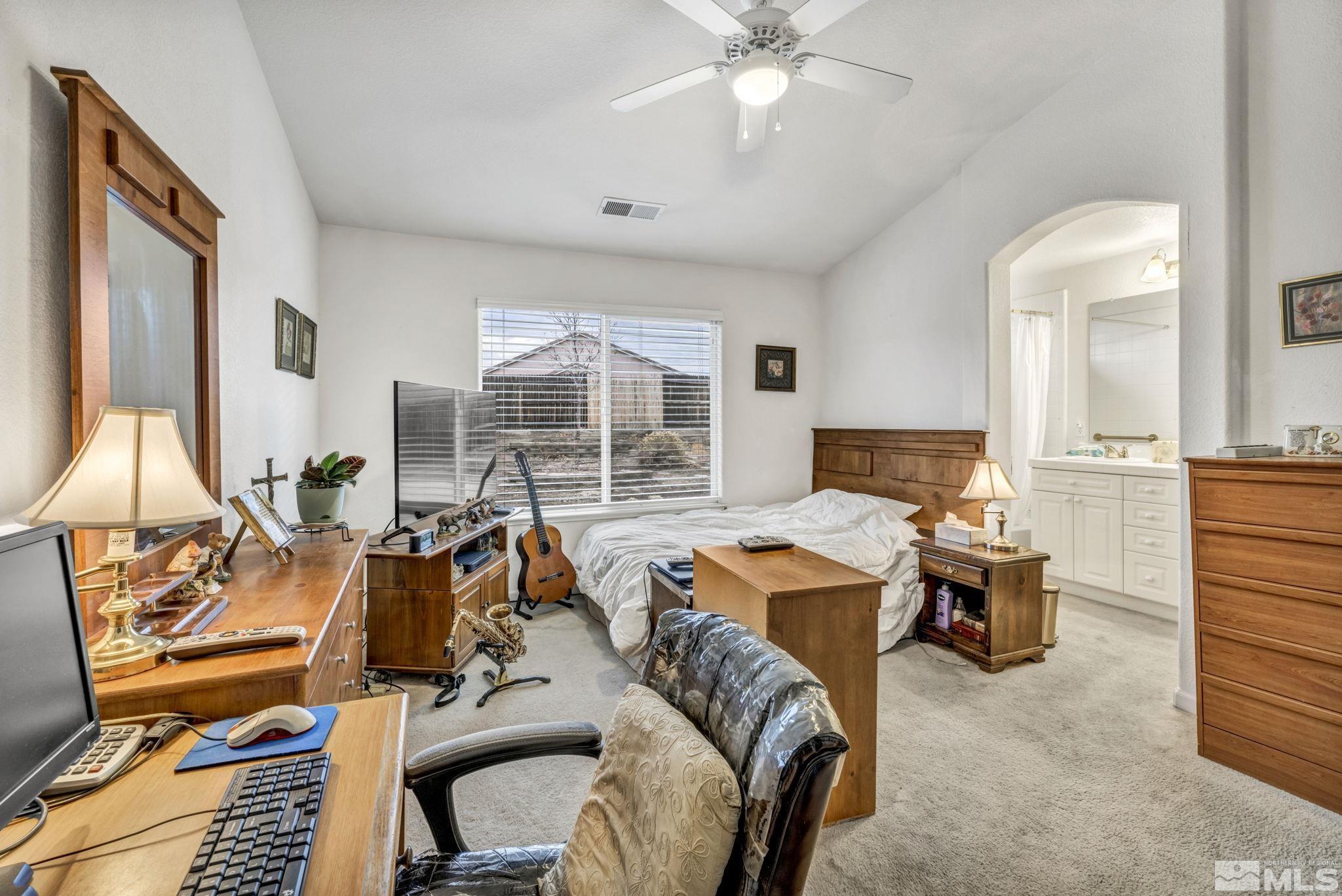 1770 Ornellaia Way Reno, NV 89521 - Photo 18 of 37 a living room with furniture windows and a flat screen tv