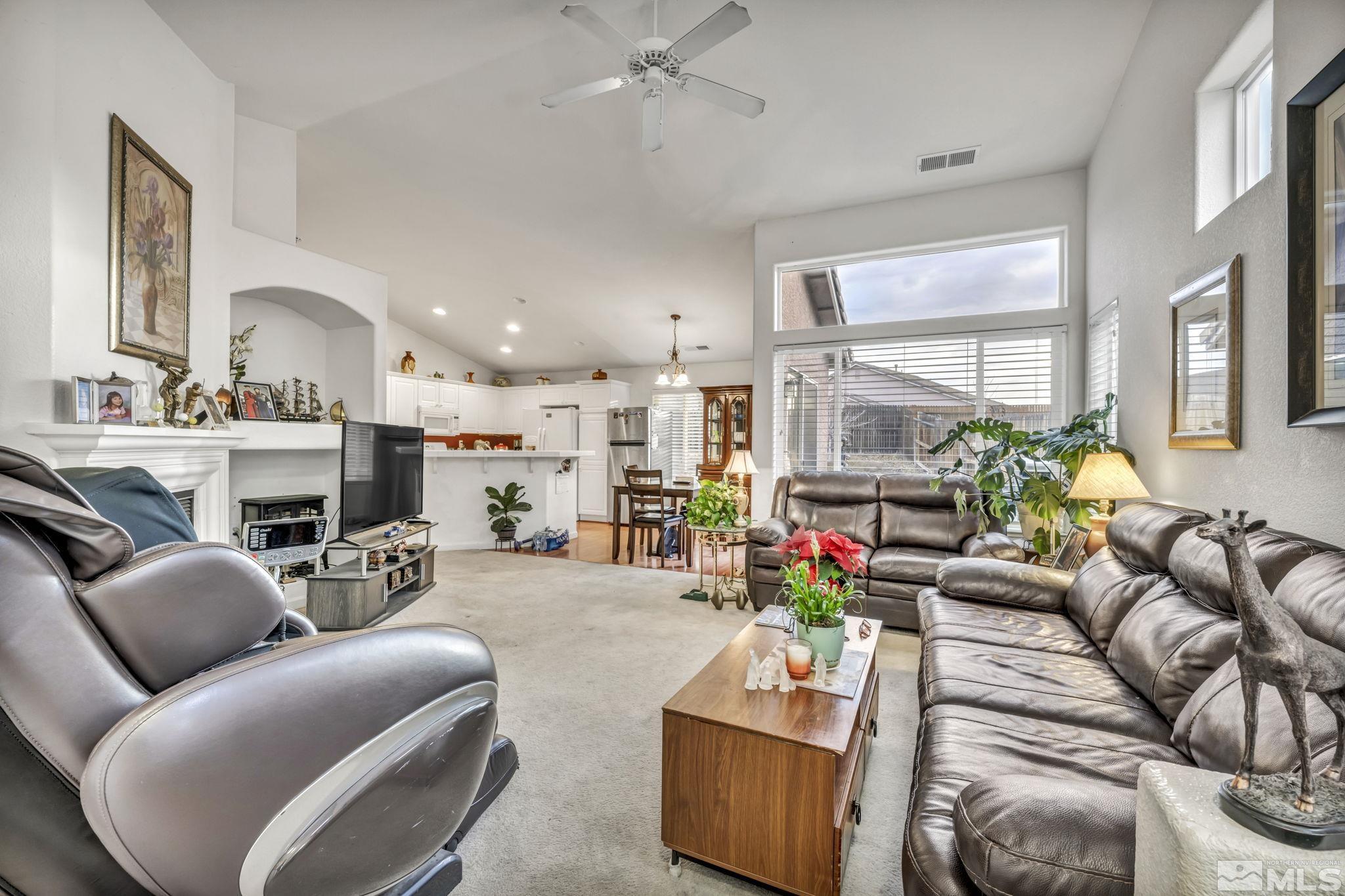 1770 Ornellaia Way Reno, NV 89521 - Photo 22 of 37 a living room with furniture fireplace and a large window