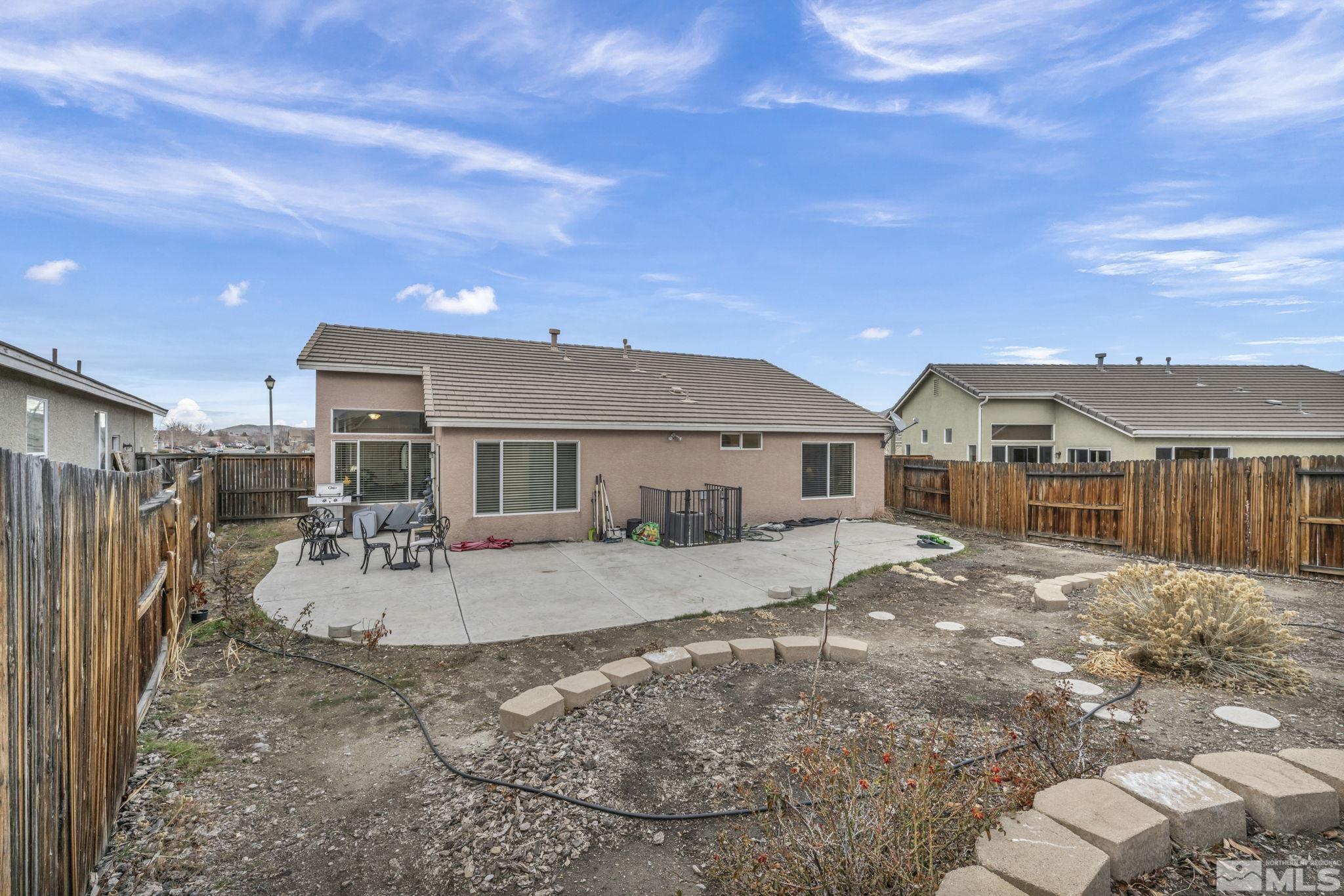 1770 Ornellaia Way Reno, NV 89521 - Photo 34 of 37 a view of a house with backyard and a tree