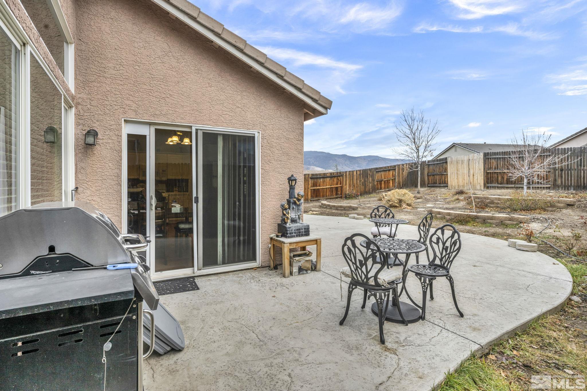 1770 Ornellaia Way Reno, NV 89521 - Photo 36 of 37 a view of a patio with a table and chairs and potted plants