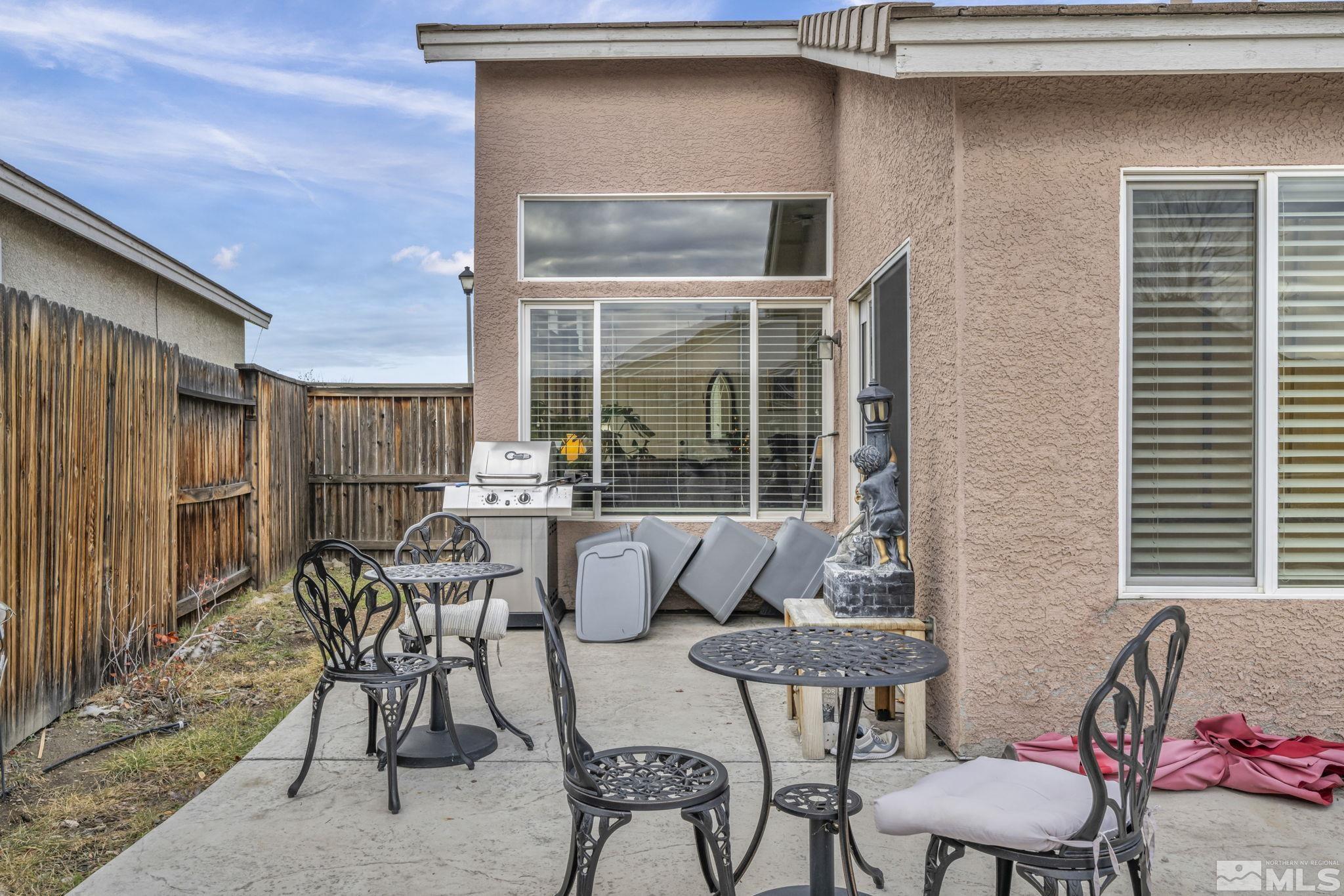 1770 Ornellaia Way Reno, NV 89521 - Photo 37 of 37 a view of a patio with table and chairs and potted plants
