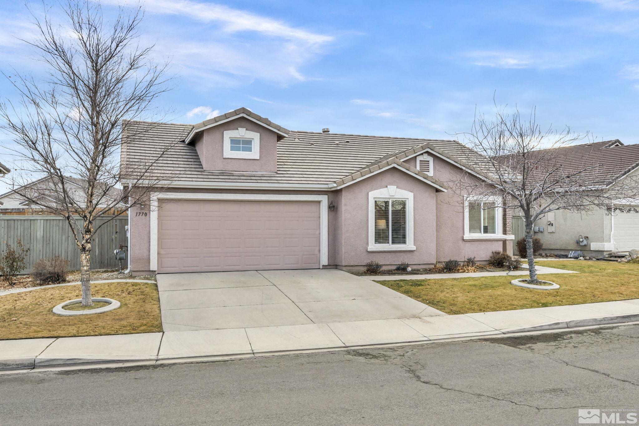 1770 Ornellaia Way Reno, NV 89521 - Photo 6 of 37 a view of a house with a big yard and large trees