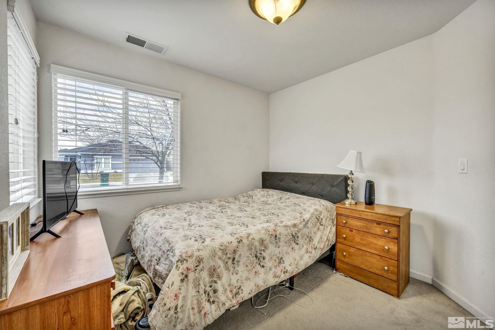 1770 Ornellaia Way Reno, NV 89521 - Photo 10 of 37 a bedroom with a bed and a window