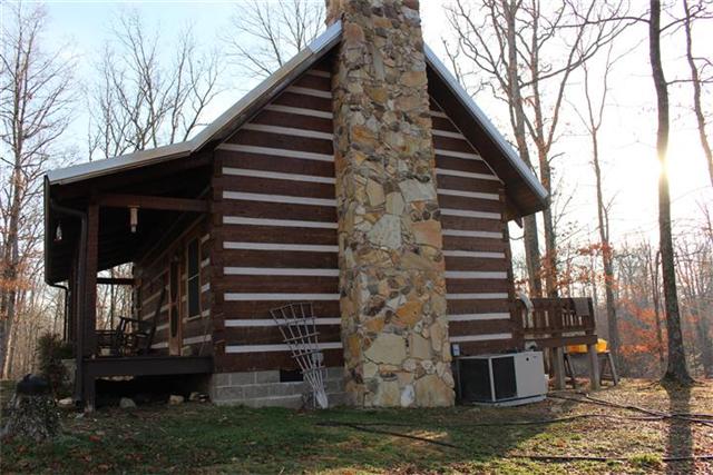 217 Amanda Road Dover, TN 37058 - Photo 6 of 20 Stone chimney, full length covered front porch, and full length back deck.