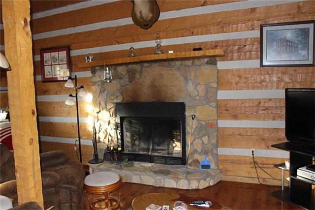 217 Amanda Road Dover, TN 37058 - Photo 8 of 20 Stone fireplace - open living-kitchen-bedroom area.