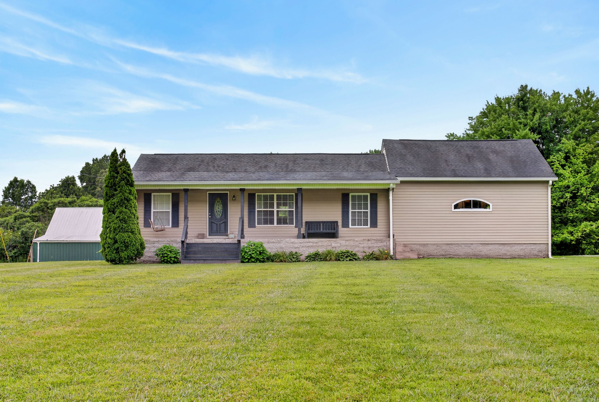 8023 Bethlehem Road Springfield, TN 37172 - Photo 20 of 55 a front view of a house with a yard and garage