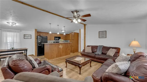 a kitchen with a sink appliances and cabinets