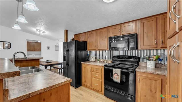 a view of a livingroom with furniture and wooden floor