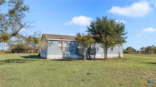 a view of backyard of house